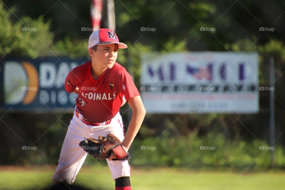 Young baseball player concentrating on next pitch