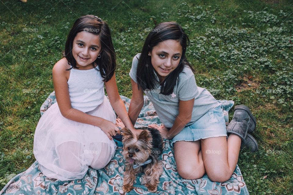 Sisters with their dog 