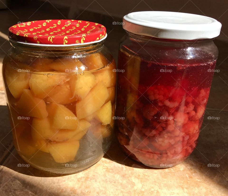 A compote of raspberries and peaches