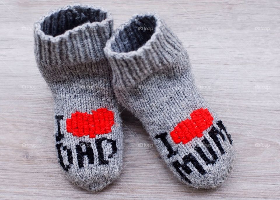 Pair of socks on wooden table