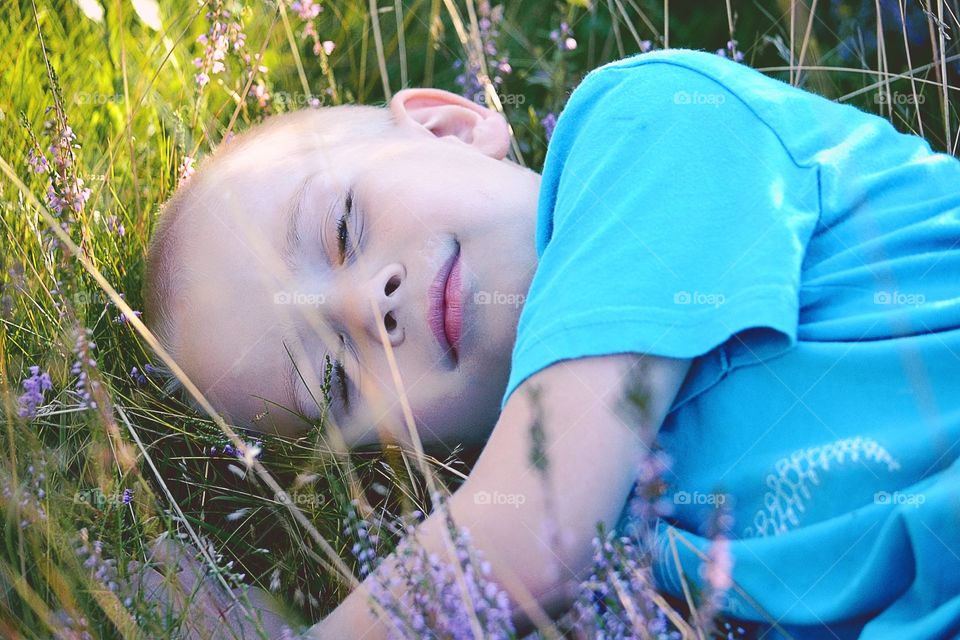 Smiling. Boy enjoys the day outside