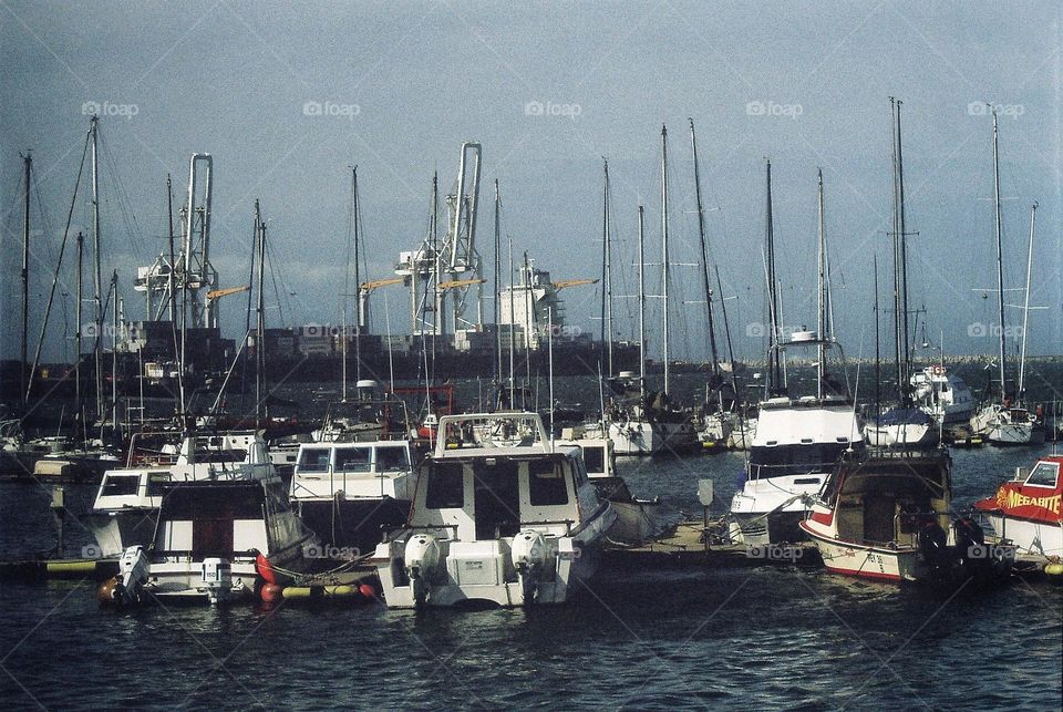 boats in the harbor. film camera.