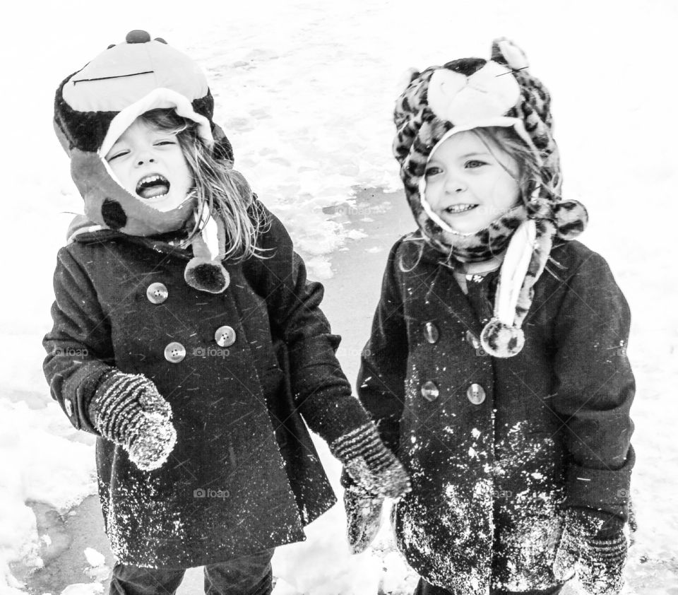 Happy cute girls in snow