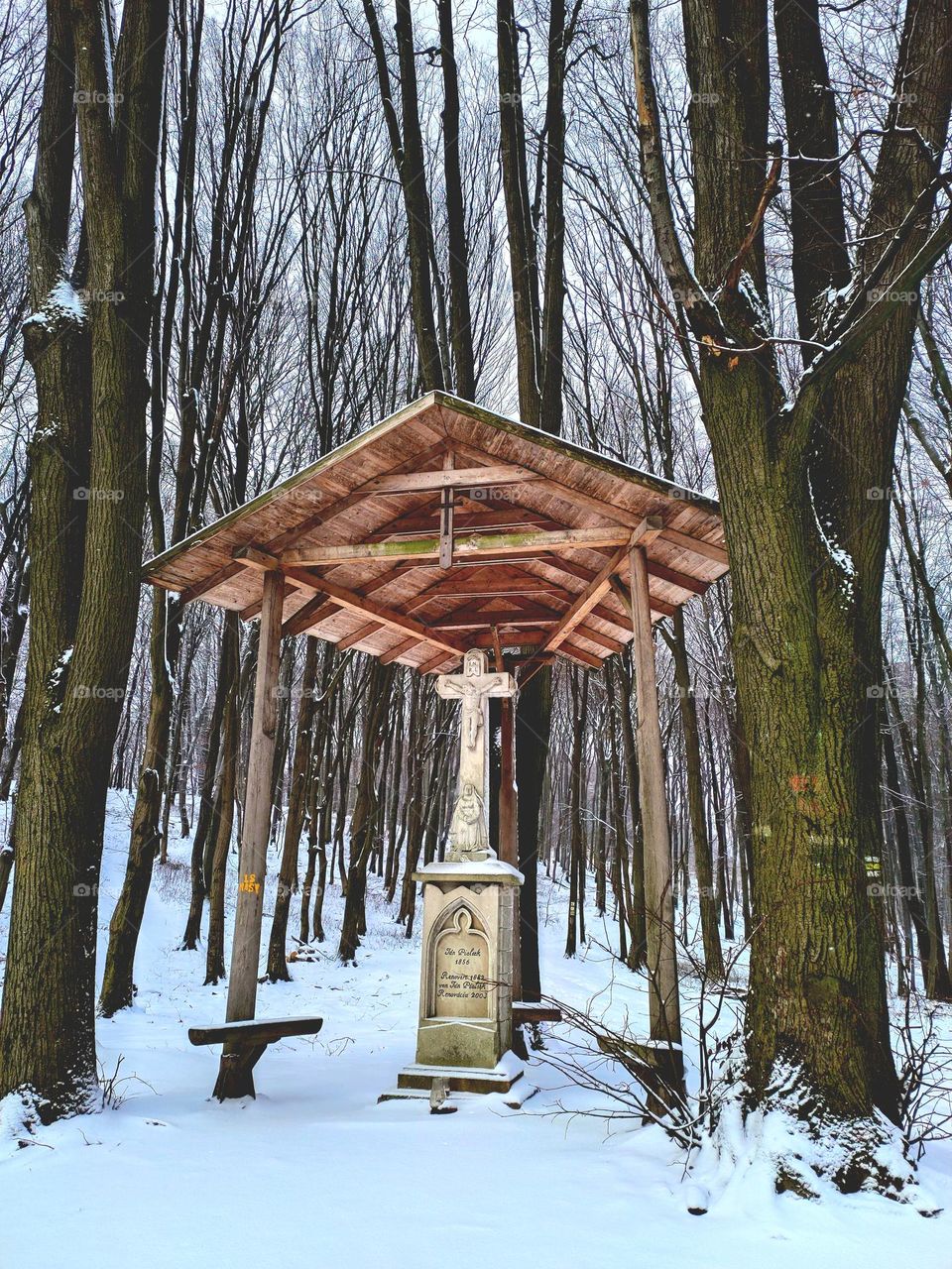 mini chapel in snowy forest