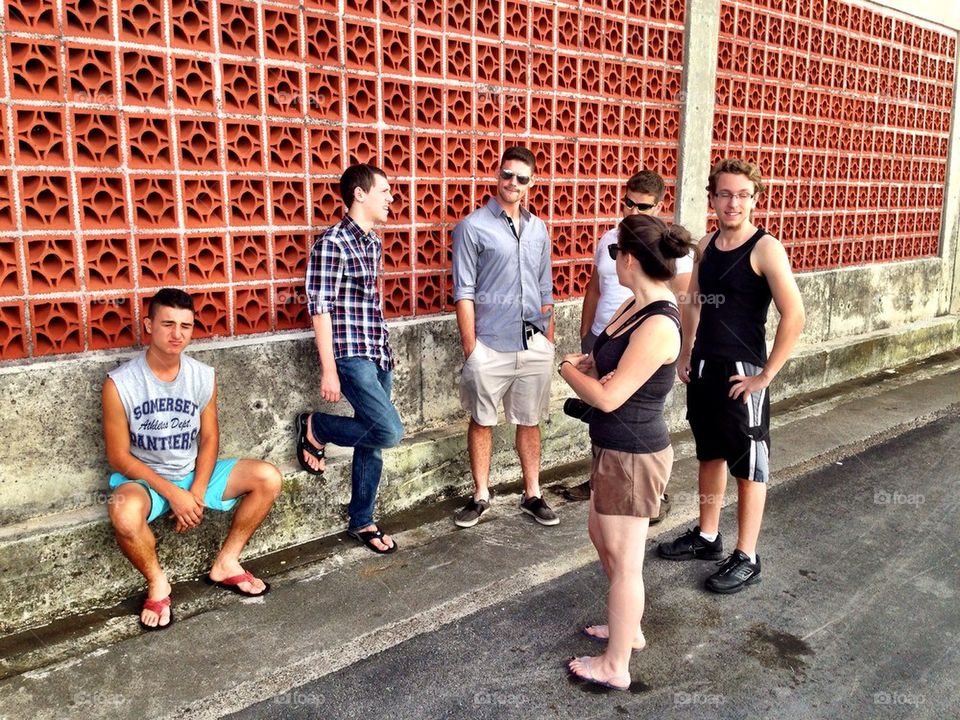 Group if friends hanging out in the street, Nassau