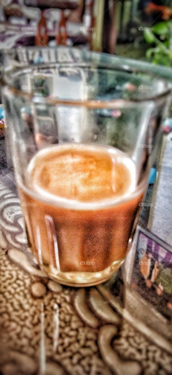 a glass of tea with artistic look
