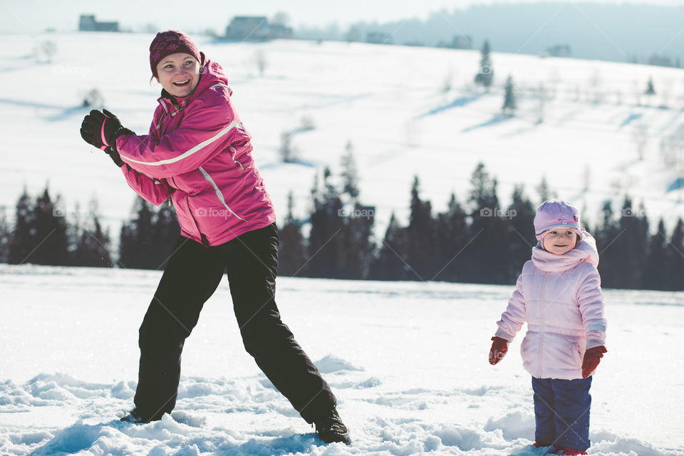 Winter with friends. Spending wintertime outdoors playing with snow