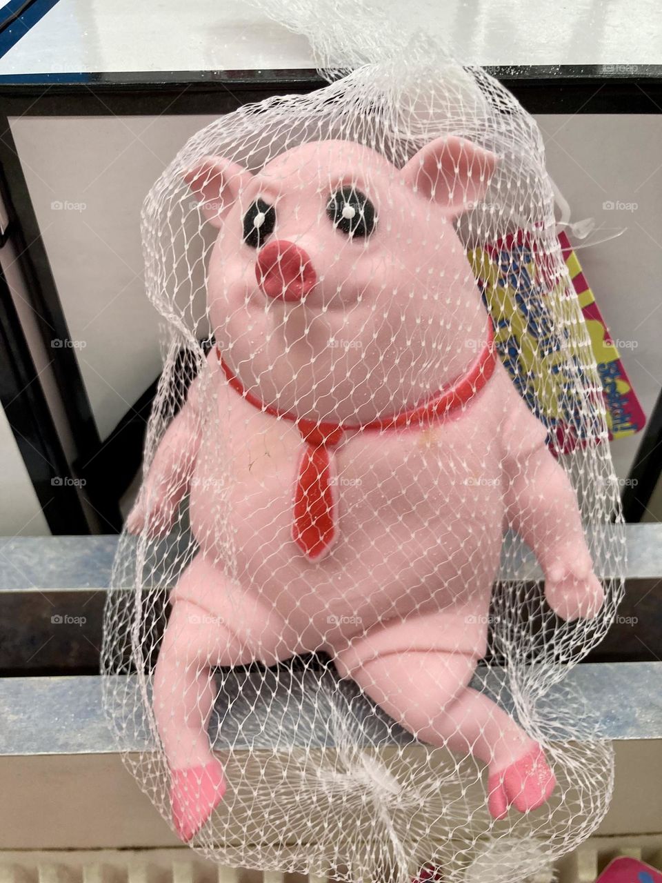 Strange pig toy in a tie 