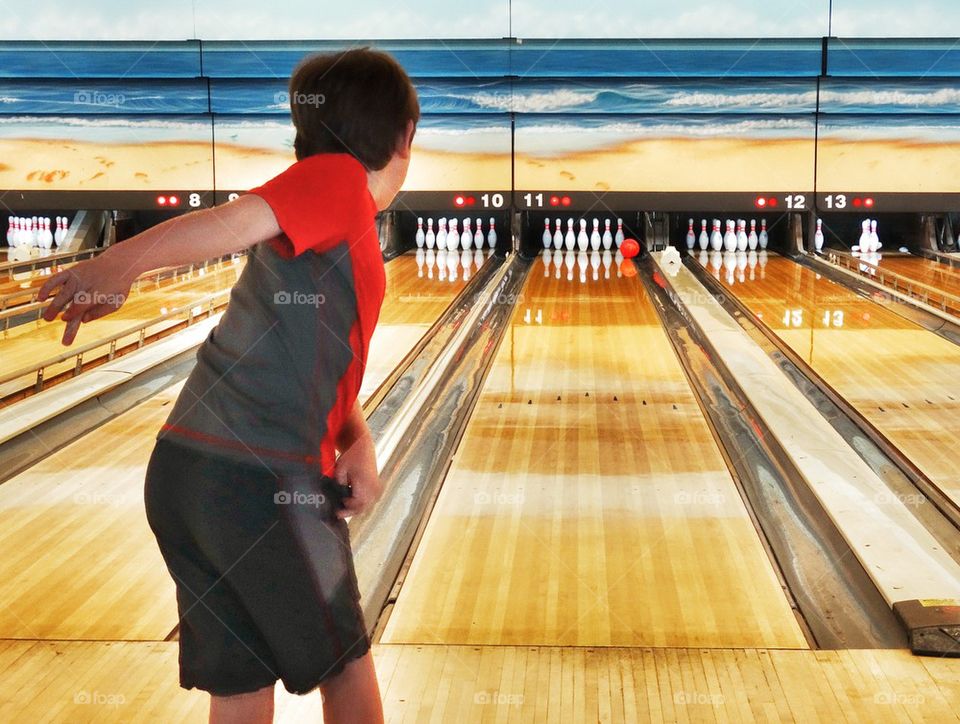 Boy In A Bowling Alley. American Indoor Sports
