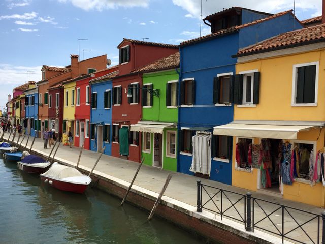Canal in Burano. Multi coloured houses on the Venetian island of Burano