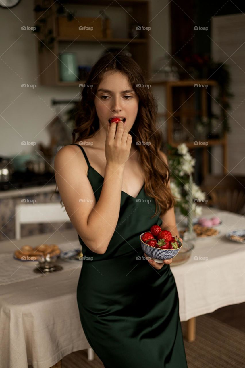 Beautiful girl eat strawberries 