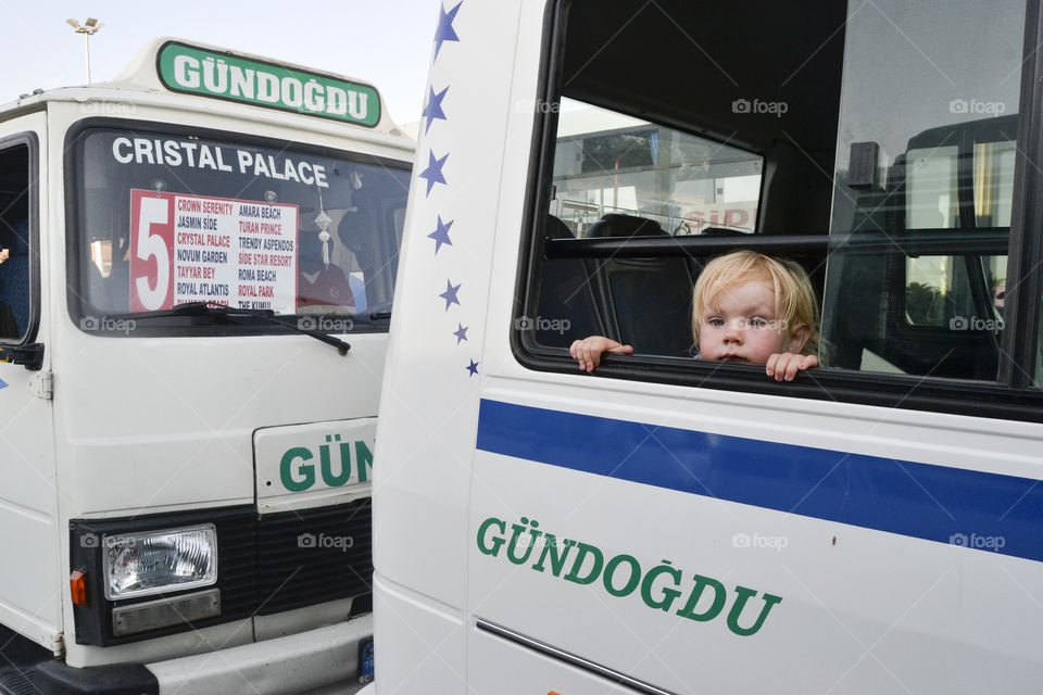 little girl looking curious out of the bus window before the local bus leaves the local bus stop in Alanya in Turkey.
The little Swedish girl is Wilda Hilner 2 years old at the time, in Turkey with her mom and dad (photographer) on vacation.
For further info if needed contact (Photographer, dad) Jens C Hilner +46 762142730 info@photomedia.se