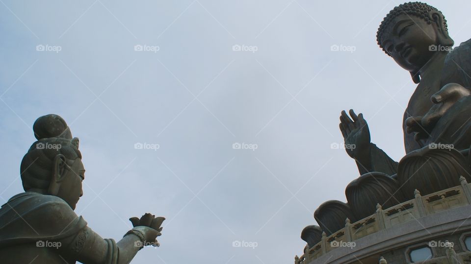 Offering. Bronze statues, making an offering to Tian Tan Buddha at Lantau Island, Hong Kong