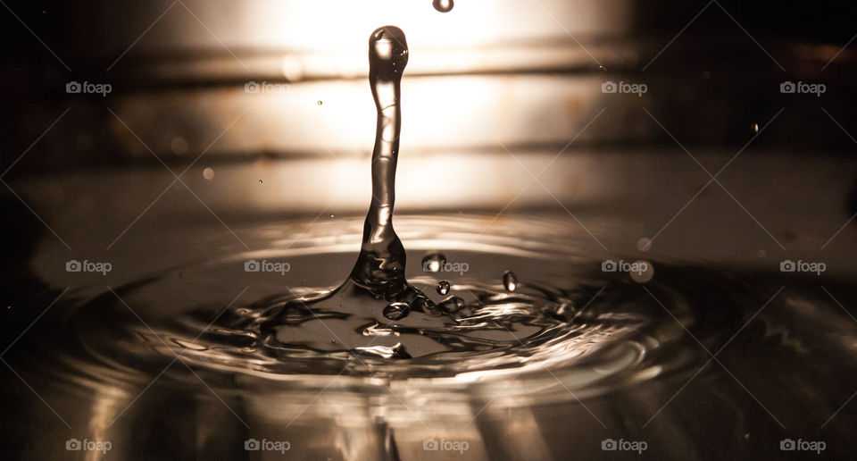 Detail of drop falling in water