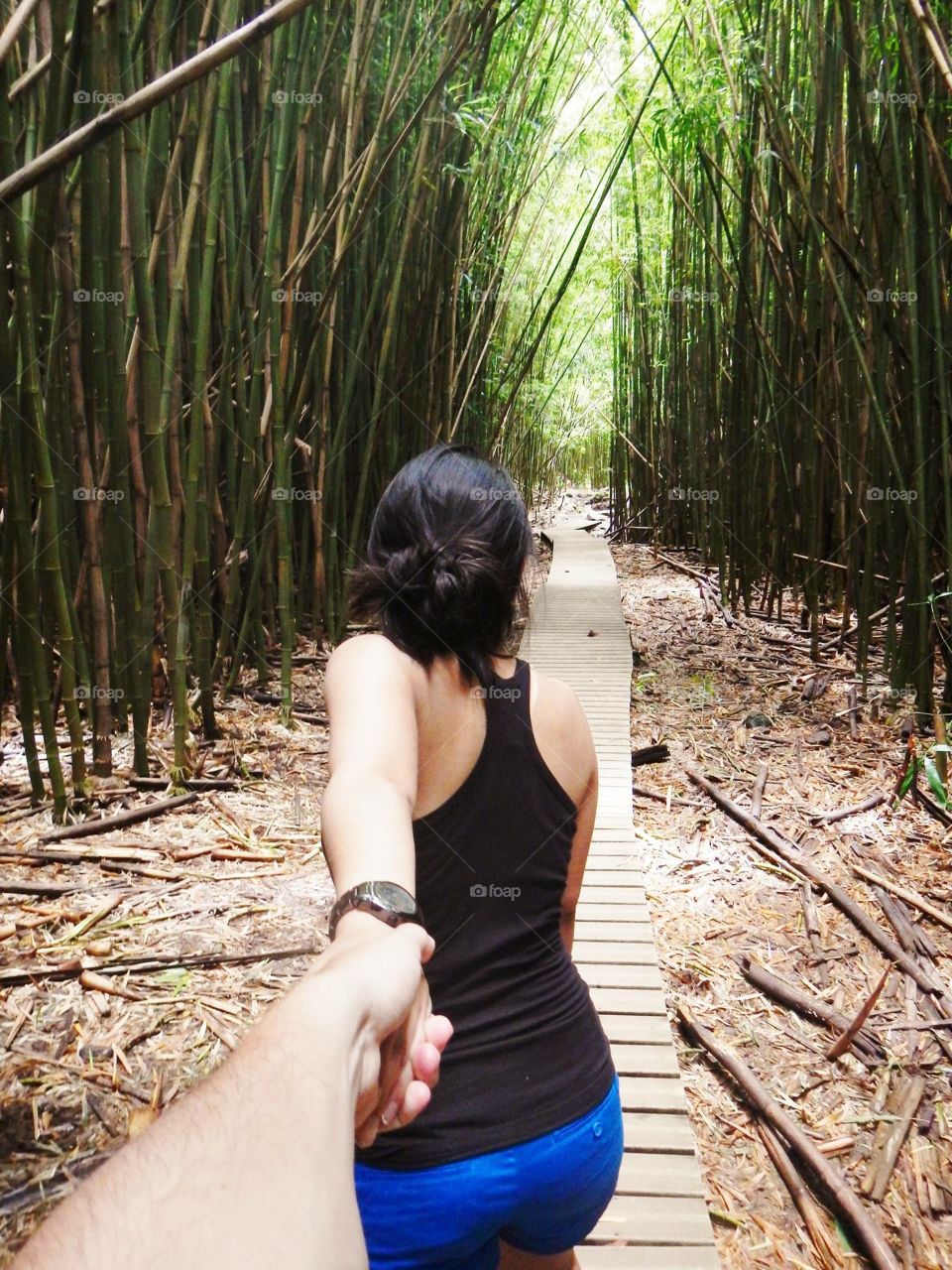 Bamboo Wonder. Maui hiking through bamboo forests to a waterfall. 