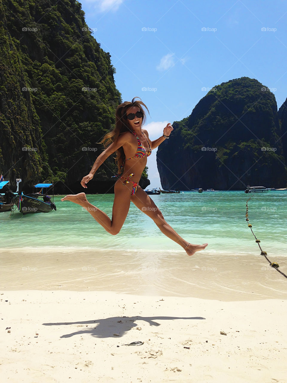 Young woman enjoying the tropical vacation at the seaside of island in Thailand 