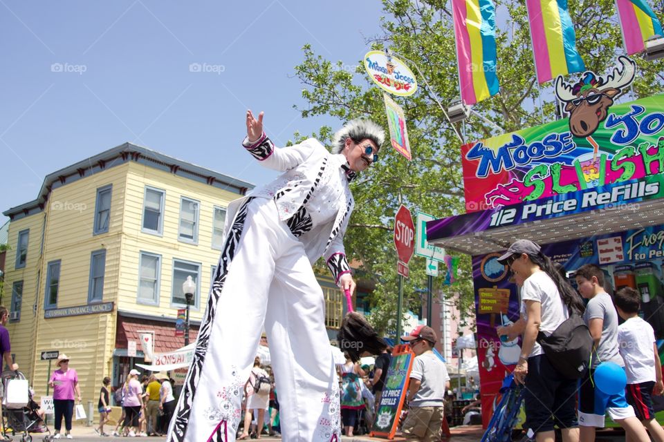 Stilt Man. Tall man at a carnival. 