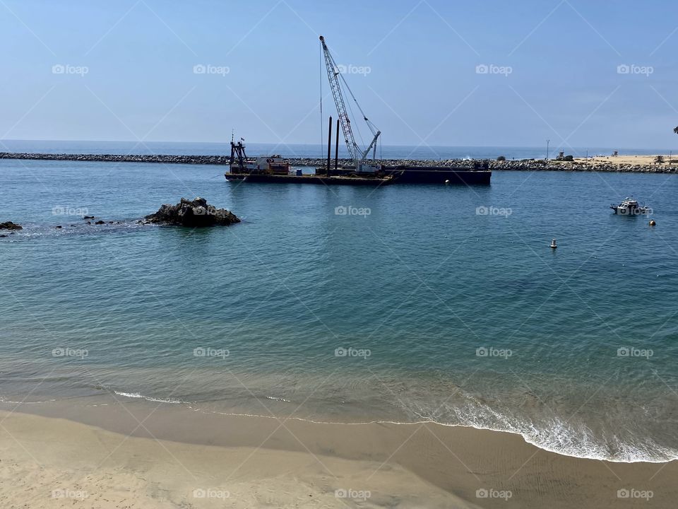 View of a dredge from Pirates Cove Beach 