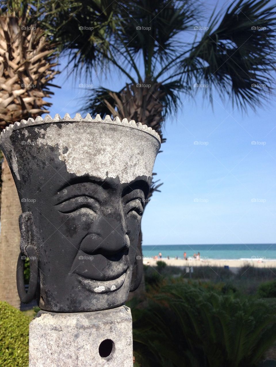 Tiki torch with ocean and background