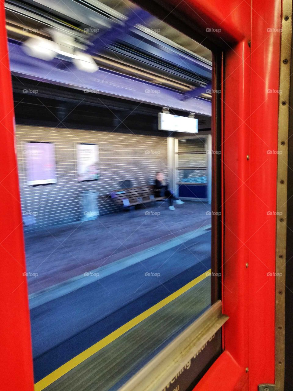 Looking out a train window.