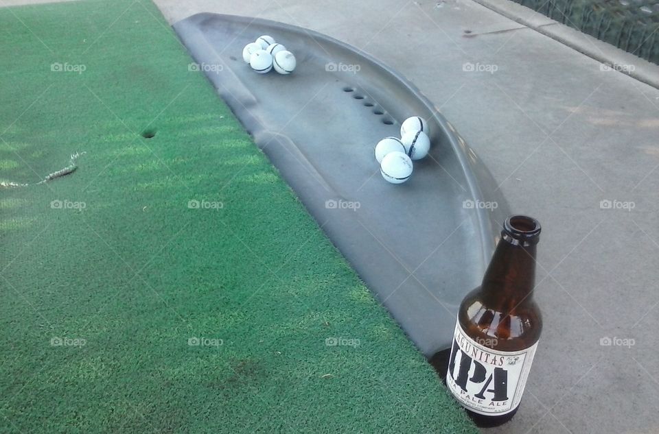 Enjoying a beer while working on my swing at a diving range