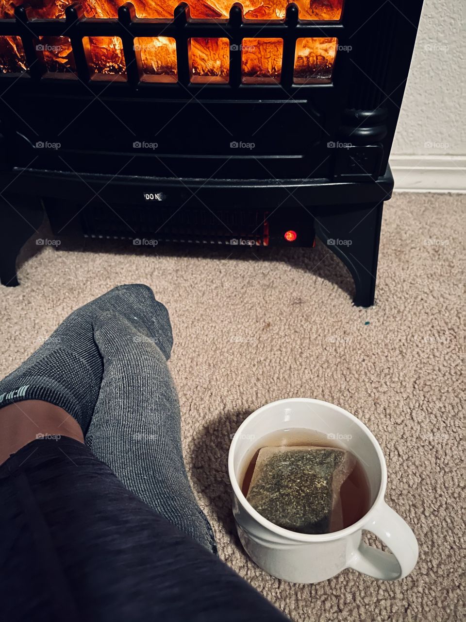 Having a night tea in front the fireplace
