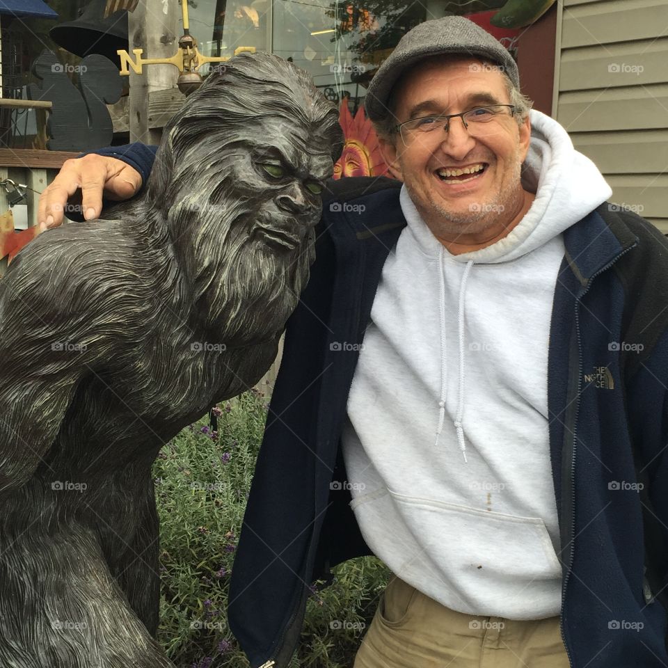 Man standing with statue