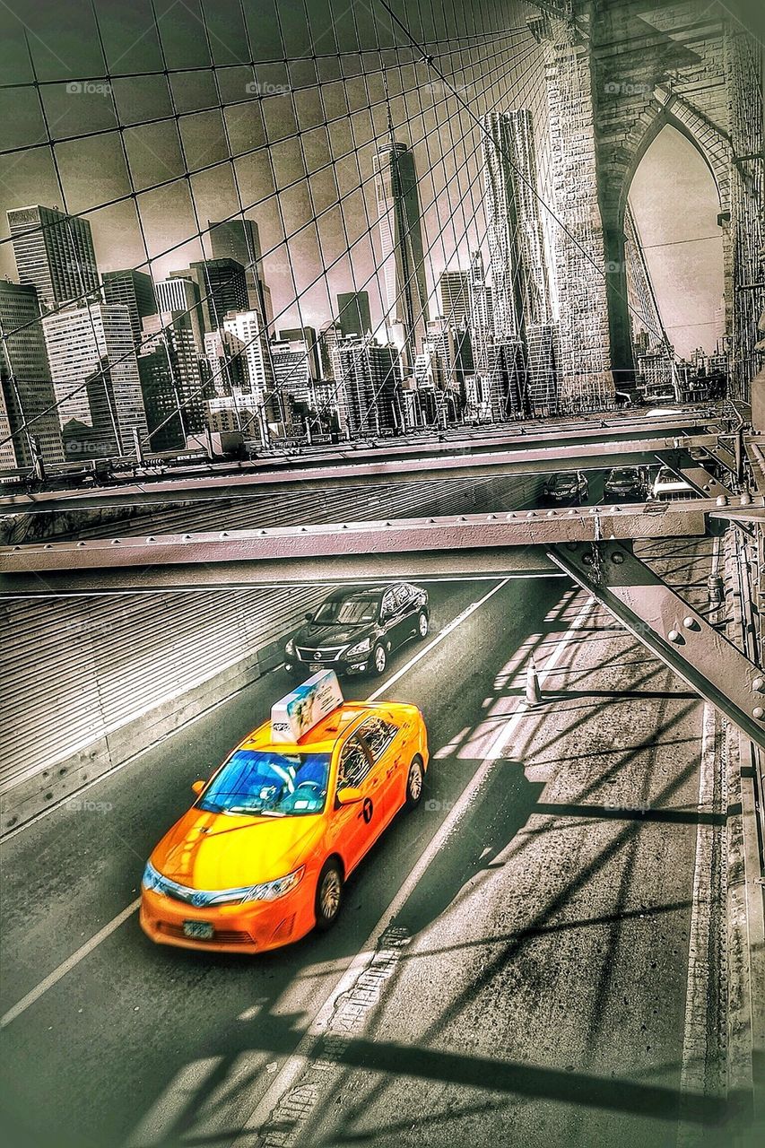 Yellow cab at the Brooklyn bridge