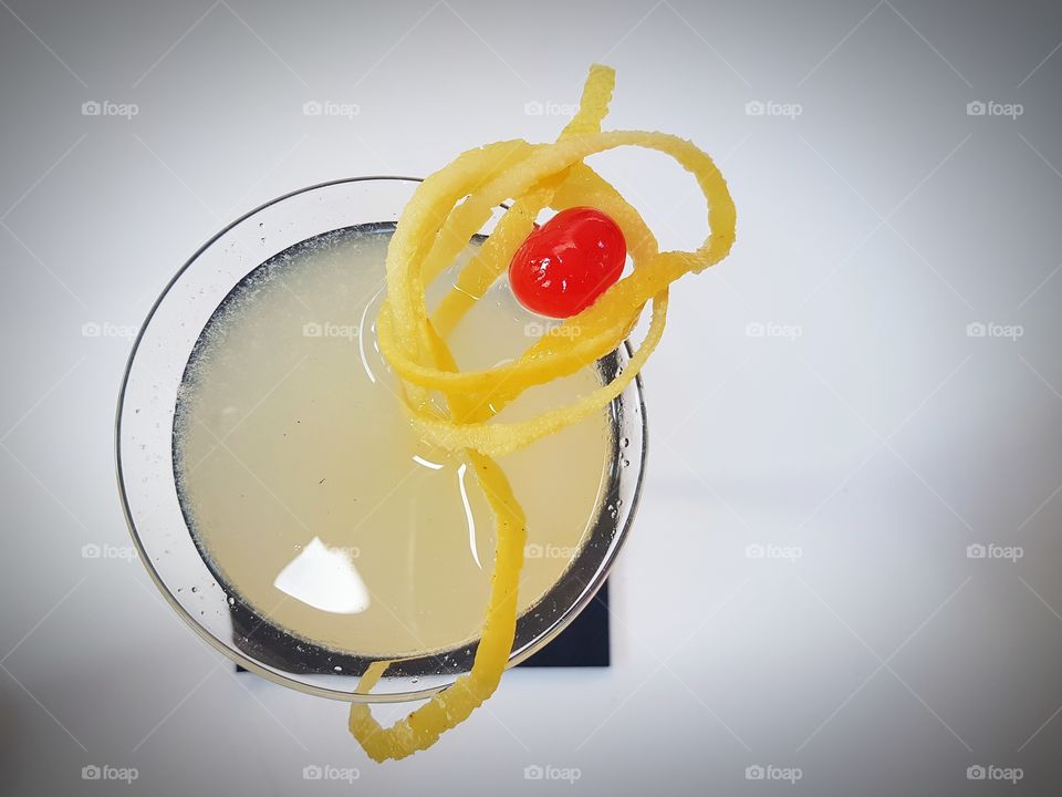 Darjeeling cocktail with lemon peel and cherry