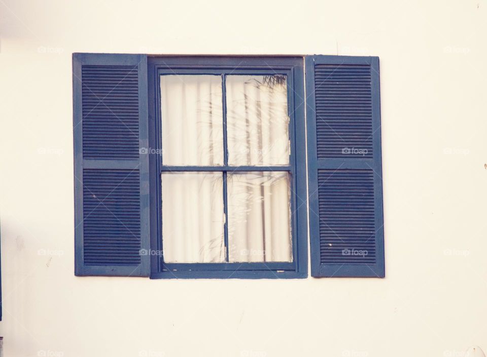 Blue window shutters