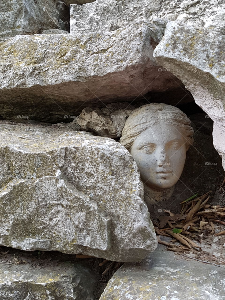 Stone Roman face rocks old