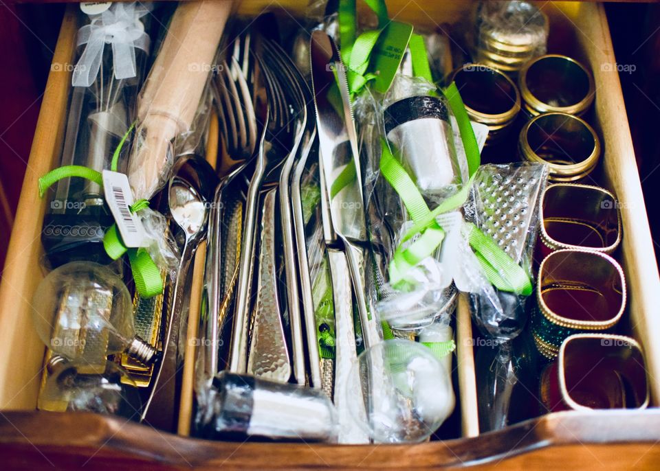 Drawer with silverware and napkin rings and things