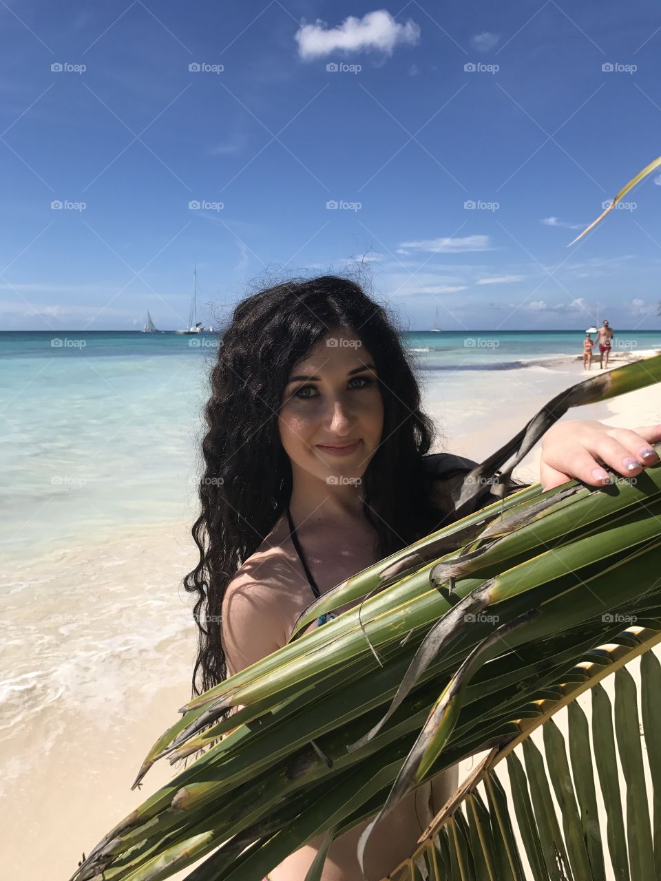 Portrait of beautiful girl with palm trees