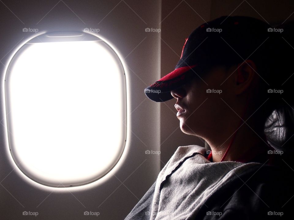 man asleep inside an airplane