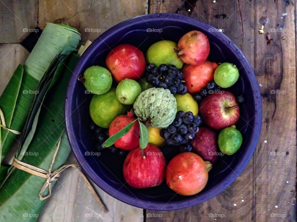 Fruits in bowl on table