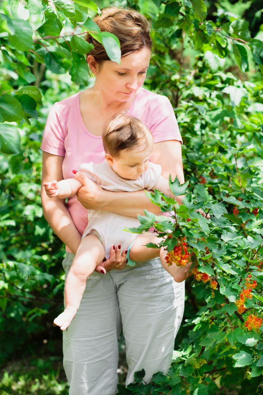 Mother with baby in the garden