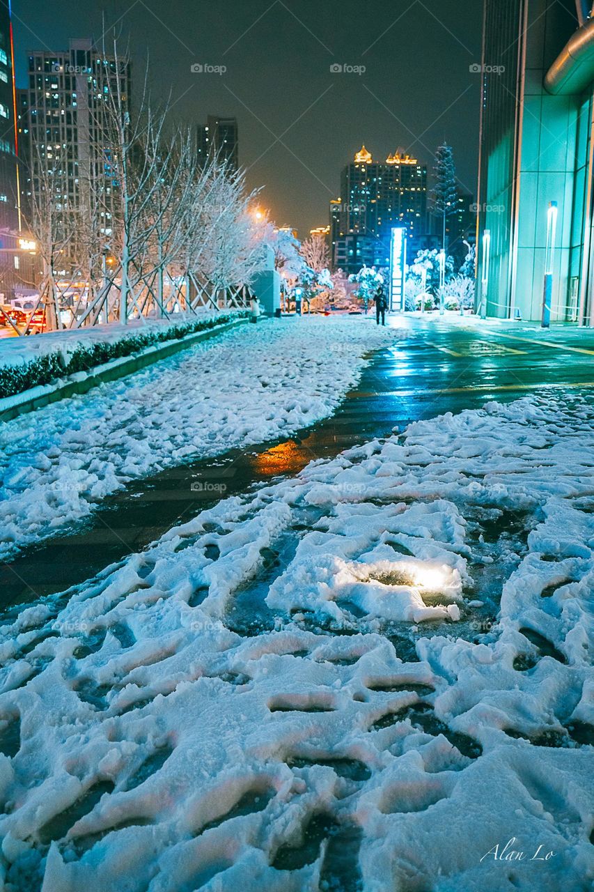 Snow on the ground in a financial district 