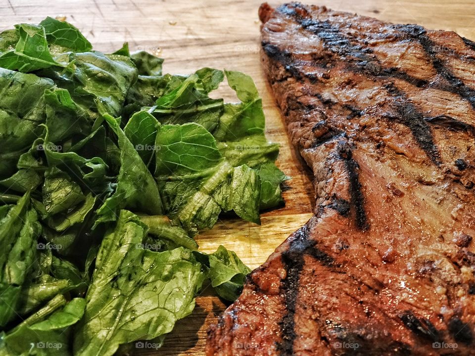 Paleo Diet. Cooked Steak And Raw Green Vegetables
