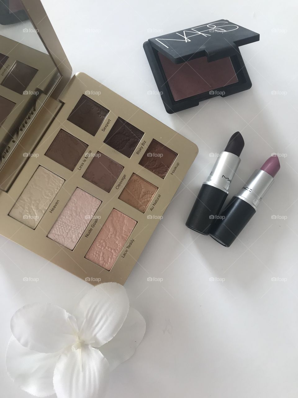 Flat lay makeup with lipstick and eyeshadow palette. Luxury makeup 