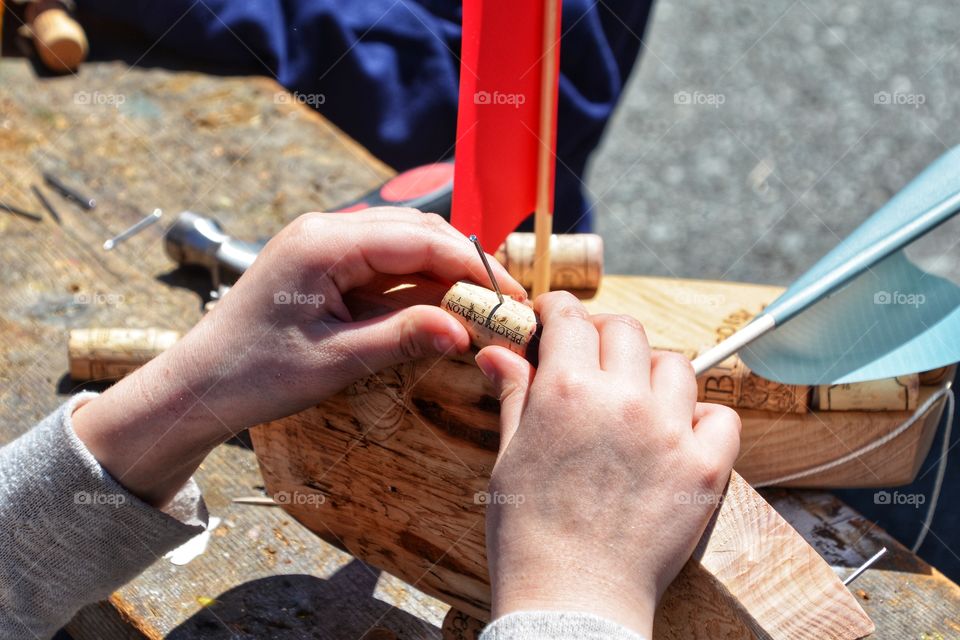 Child building a sailboat