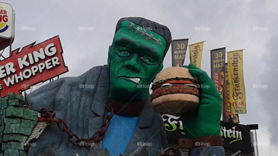 Hungry Frankenstein. Frankenstein  holding a Burger King hamburger