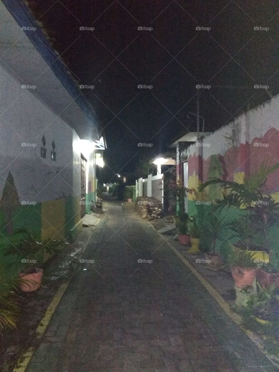 The street atmosphere is quiet and dim