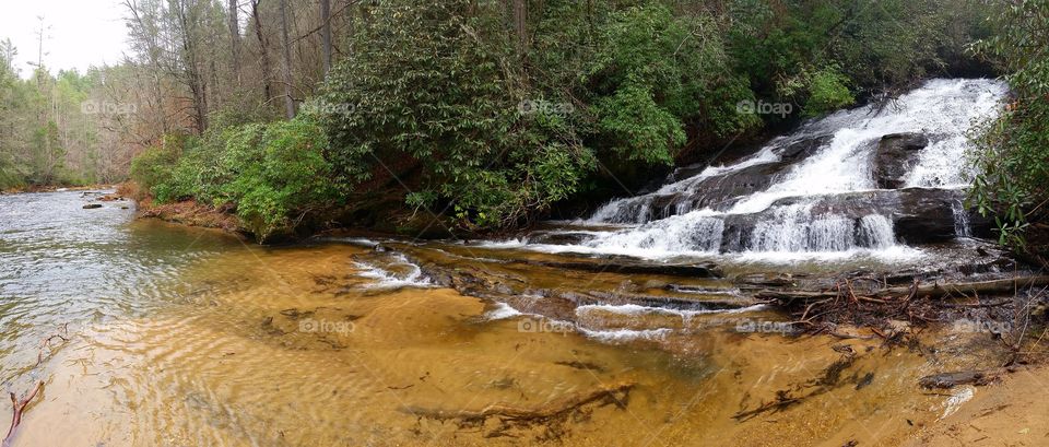 Lick log waterfall flowing into the Chattooga river in Western South Carolina