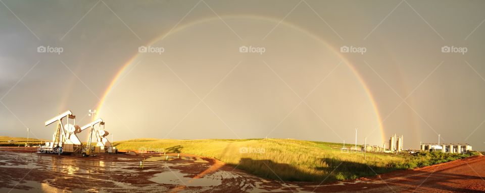 black gold rainbow. panoramic of a double rainbow while working the oil feilds in North Dakota