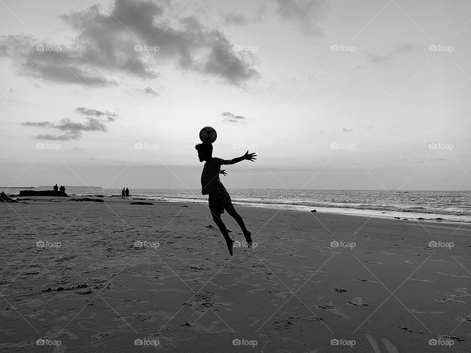 Boy playing at the beach 