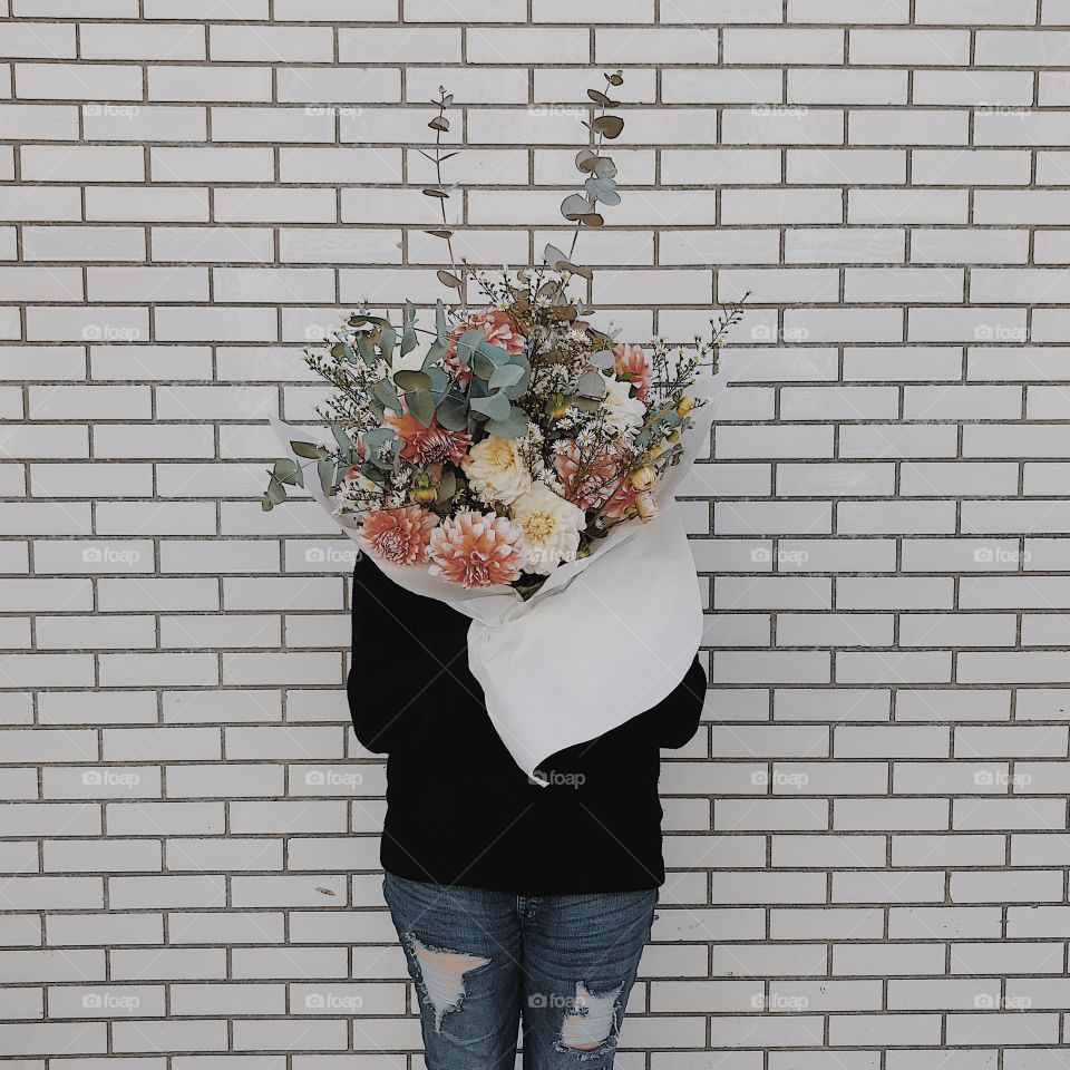 A floral arrangement as big as my head + a beautiful white brick wall found in a charming little downtown 