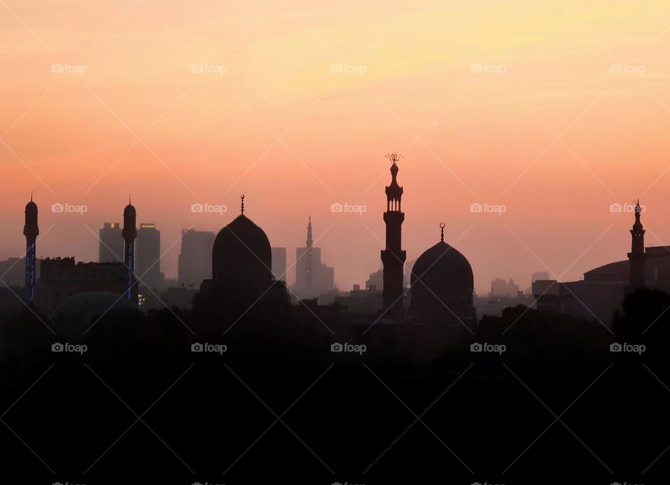 Silhouette of mosques and domes at sunset