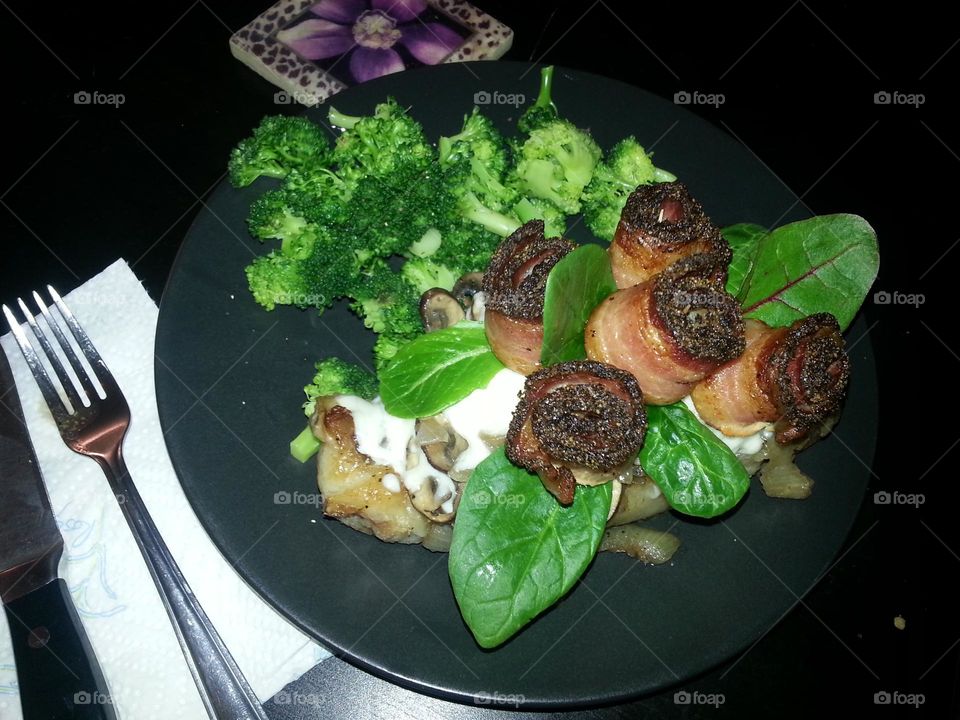 mushroom and mozzarella smothered steak with peppered bacon roses for Valentine's day