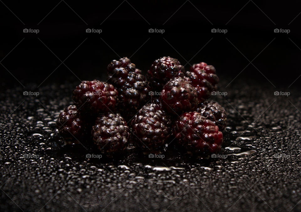 Fresh juicy and sweet mulberry. Mulberry close-up. Beautiful black background