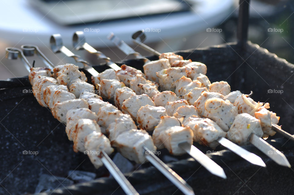 Meat preparing on barbecue